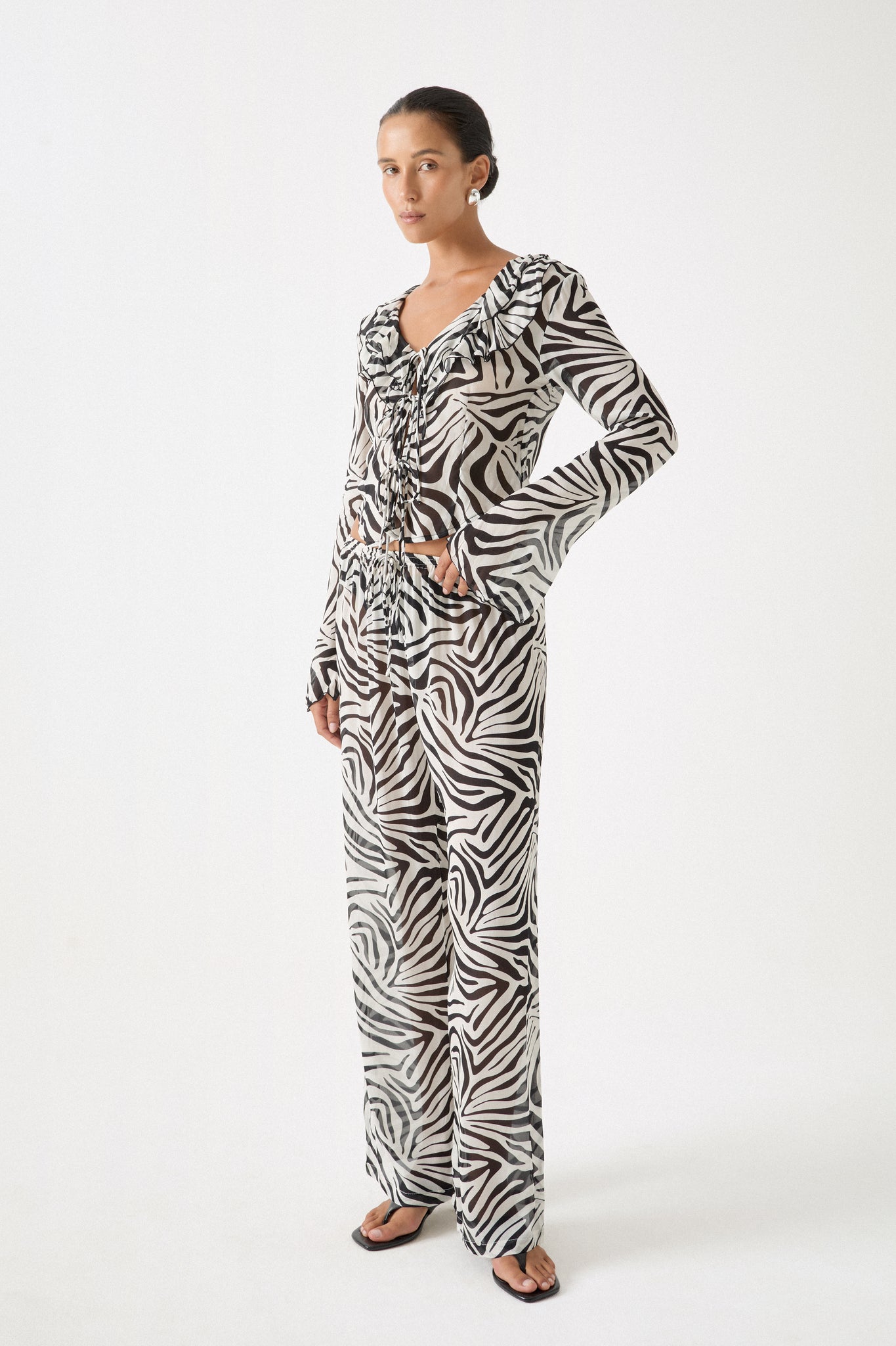Zebra print two-piece set with wide-leg pant and matching tie-front blouse