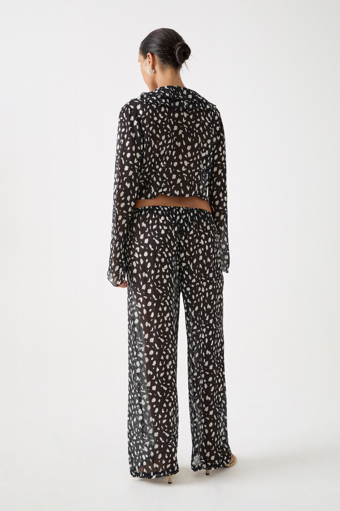 Jivan Shirt shown from behind with draped sheer back and relaxed fit