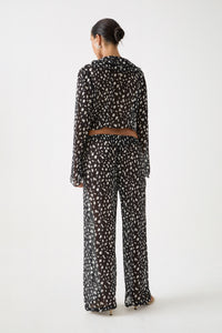 Jivan Shirt shown from behind with draped sheer back and relaxed fit